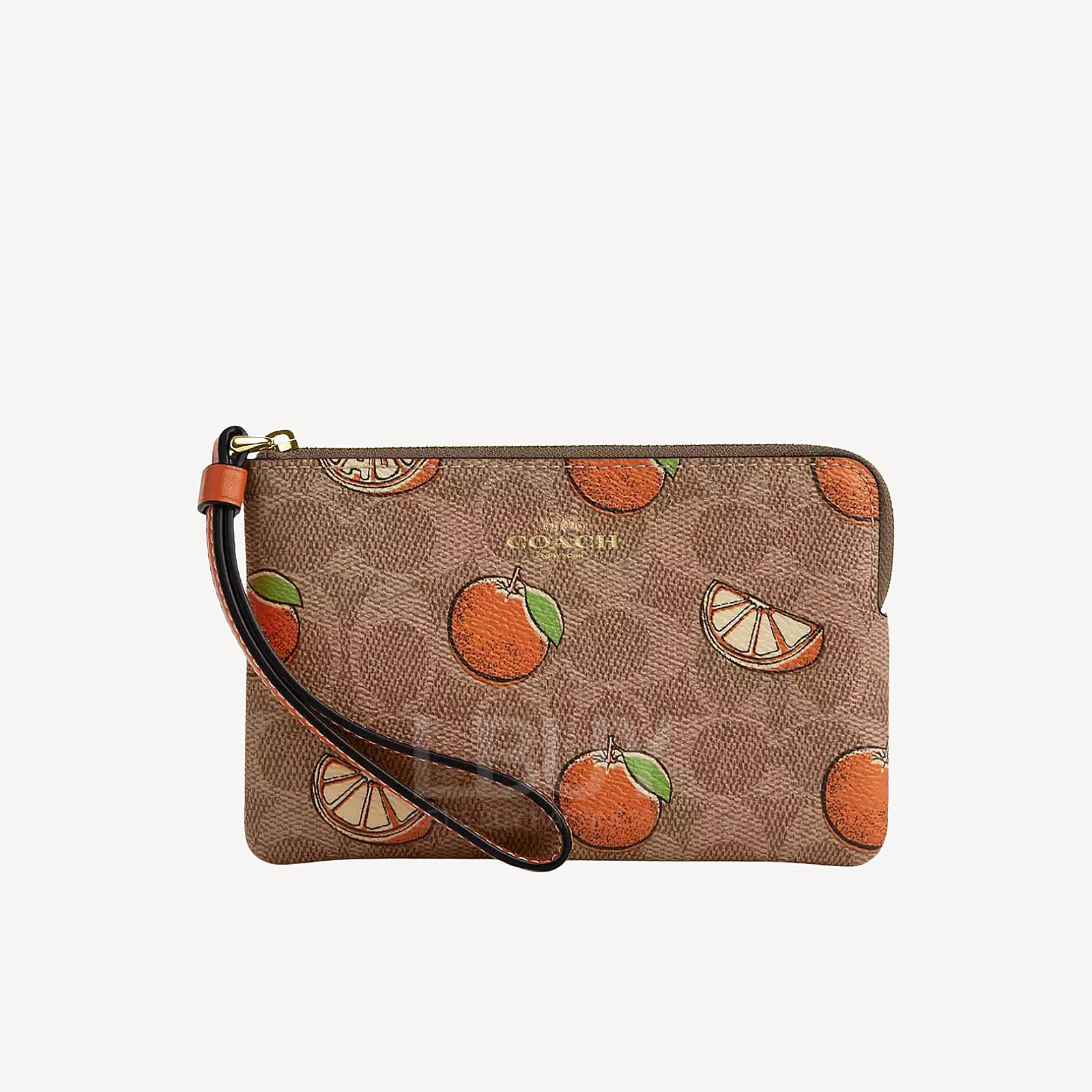 Coach Corner Zip Wristlet In Signature Canvas With Orange Print